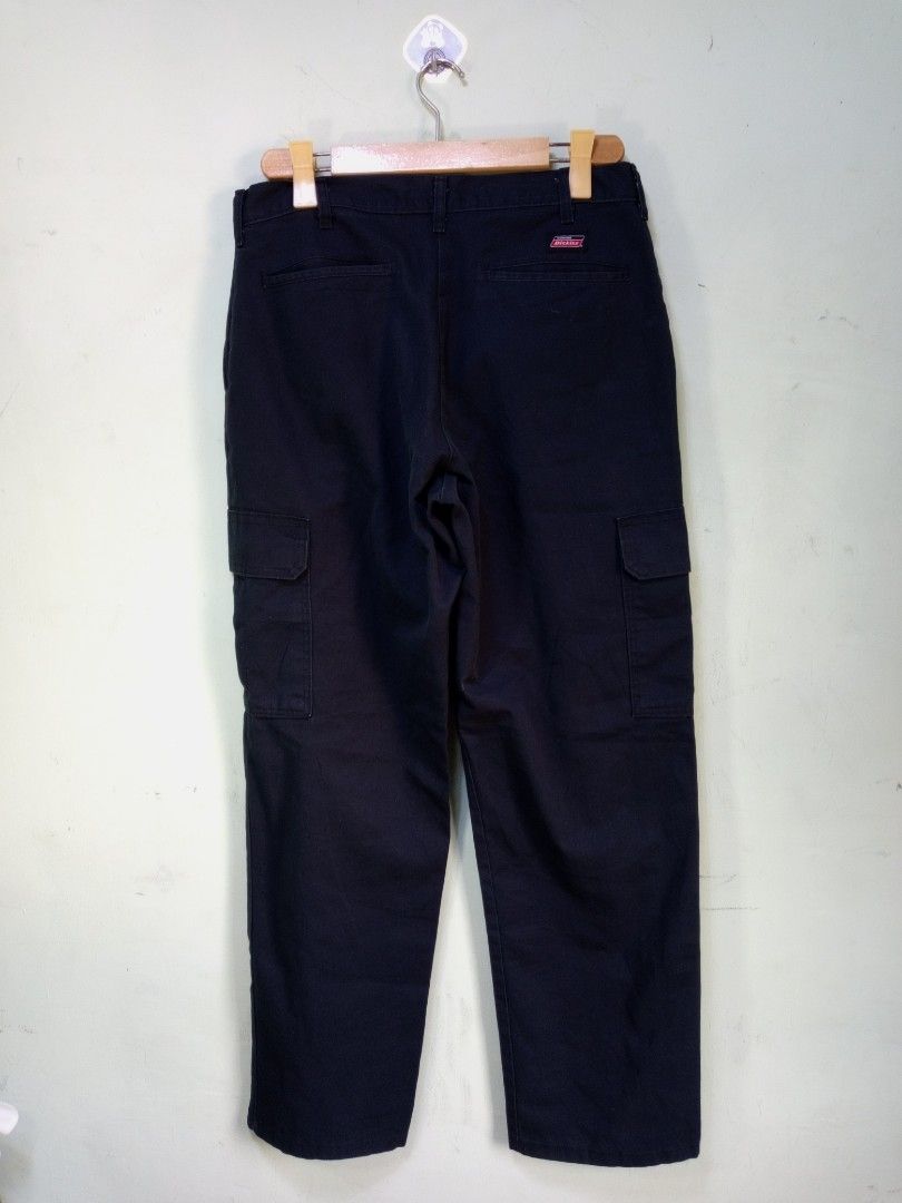 Genuine Dickies Black Cargo Pants (Category: Trousers) located in Manila. Submitted by onewikstraight (Listing ID 1470209680, Image 1). Description: - Brand: Genuine Dickies - Color: Classic Black - Fit: Relaxed fit for all-day comfort - Pockets: Multiple utility pockets on sides and back - Details: Standard button and zip closure with belt loops - Style: Great for everyday workwear or streetwear - Size 32 to 34W 42L - Condition: 9/10 pm 850+sf.