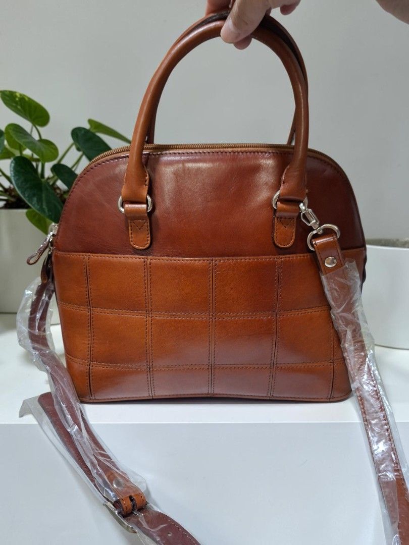 GENUINE LEATHER DOME 2WAY SATCHEL (Category: Cross-body Bags) located in Las Pinas. Submitted by annachiaonair2037 (Listing ID 1470288199, Image 3). Description: GENUINE LEATHER DOME 2WAY SATCHEL FROM JAPAN DETACHABLE ADJUSTABLE STRAP UNUSED BUT WITH MINIMAL SIGN OF STORAGE H 8" L 11" W 5".