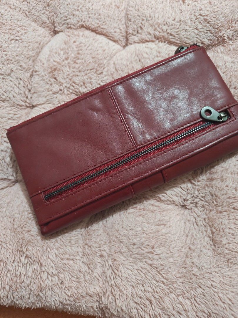 Genuine leather long wallet (Category: Wallets & Card holders) located in Taguig. Submitted by voxsummer88 (Listing ID 1470249929, Image 3). Description: likenew slightly used genuine leather long wallet color maroon, dark red.
