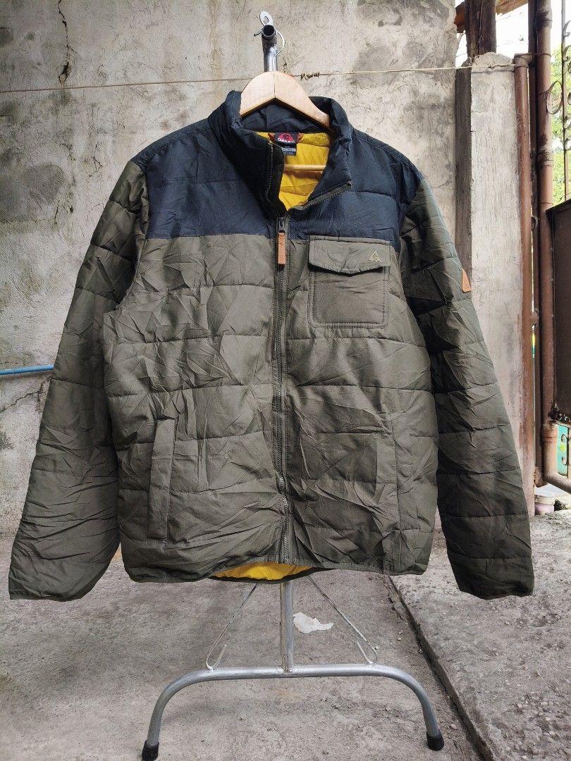 Gerry Puffer Jacket Olive Green Black Yellow (Category: Coats, Jackets and Outerwear) located in Makati City. Submitted by thriftersmakati (Listing ID 1470149025, Image 1). Description: - Brand: Gerry - Color: Olive green and black with a contrasting bright yellow inner lining - Closure: Full zip front with stand collar - Pockets: 1 chest flap pocket and lower hand pockets - Design: Quilted stitching throughout - Fit/Feel: Warm, comfortable, and 