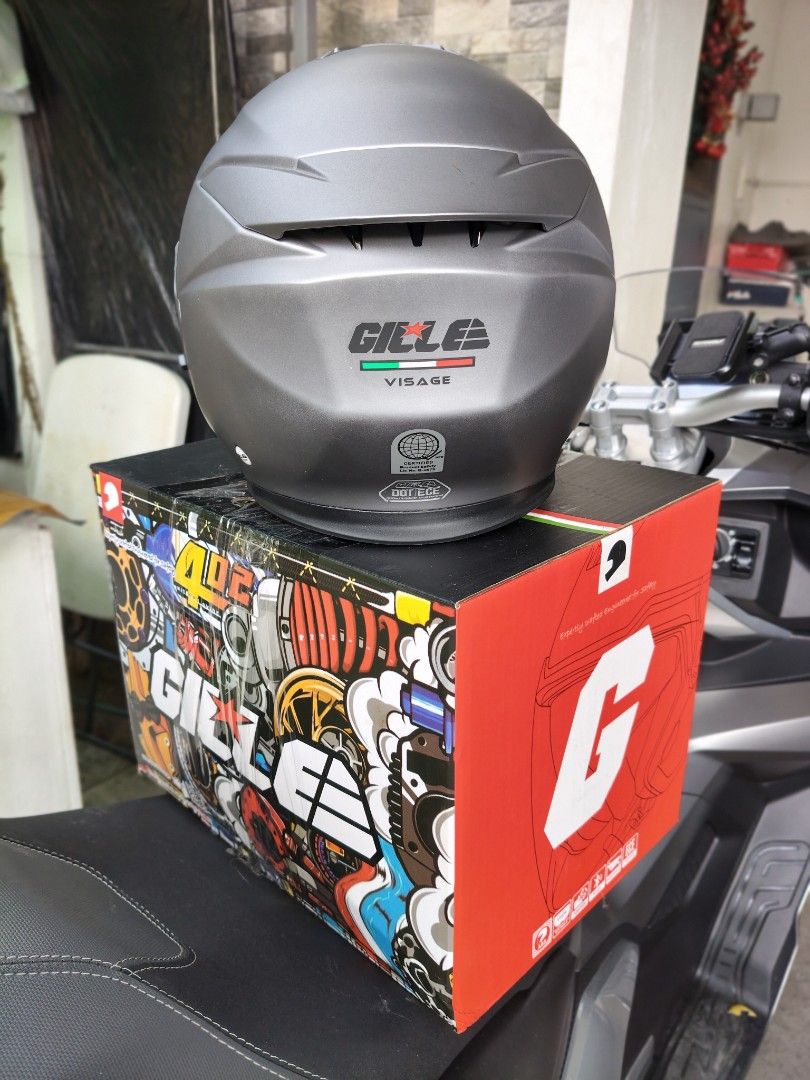 Gille Visage Open Face Helmet Matte Grey (Category: Bicycles) located in Makati City. Submitted by joel_888 (Listing ID 1470165078, Image 3). Description: - Brand: Gille Visage open face motorcycle helmet - Color: Matte grey with a pre-installed tinted visor - Interior: Removable red and black honeycomb padding for comfort and easy cleaning - Safety: DOT and ECE certified ratings printed at the back - Condition: Brand new, never worn (box opened 