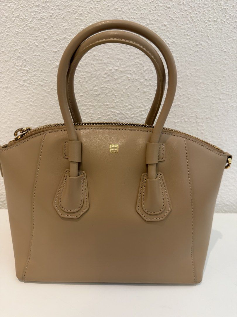 Givenchy Antigona Mini Leather Satchel Beige (Category: Luxury Bags & Wallets) located in Pasig City. Submitted by closetofashopaholic (Listing ID 1470243393, Image 2). Description: - Brand: Givenchy Antigona - Color: Classic Taupe with Gold-tone hardware - Material: Premium smooth leather - Inclusions: Dust bag, Original tag, and matching branded wide web shoulder strap - Condition: Pristine exterior and clean interior - Mode of Payment: GCash, 