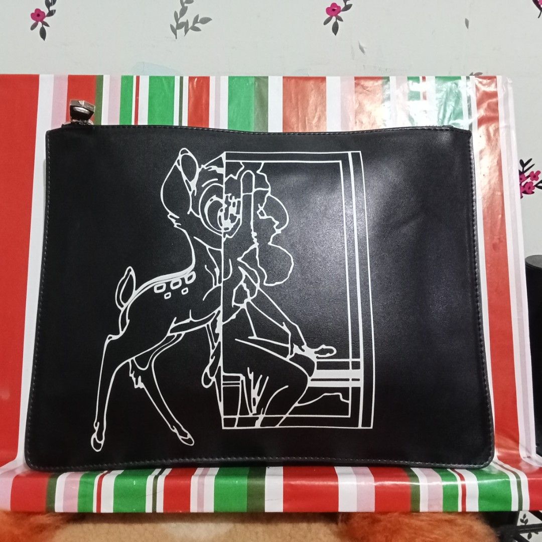 GIVENCHY BLACK LEATHER BAMBI FLAT POUCH / CLUTCH BAG (Category: Luxury Bags & Wallets) located in Hinigaran. Submitted by faye_fab02 (Listing ID 1470218836, Image 1). Description: 💥GIVENCHY made in Romania with a code AB E 0165.