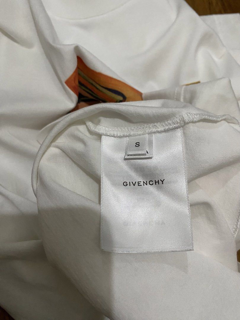 Givenchy Colorful Logo Graphic Tee Size S (Category: Shirts) located in Taguig. Submitted by maaarrrrrcky (Listing ID 1470264939, Image 3). Description: - Authentic Givenchy t-shirt in clean white cotton - Features a vibrant, painted-style graphic box logo on the chest - Classic crew neck and short sleeves - Size: S (verified by interior neck tags) - Condition: Excellent, clean, and ready to wear - Perfect for daily streetwear or casual outings -