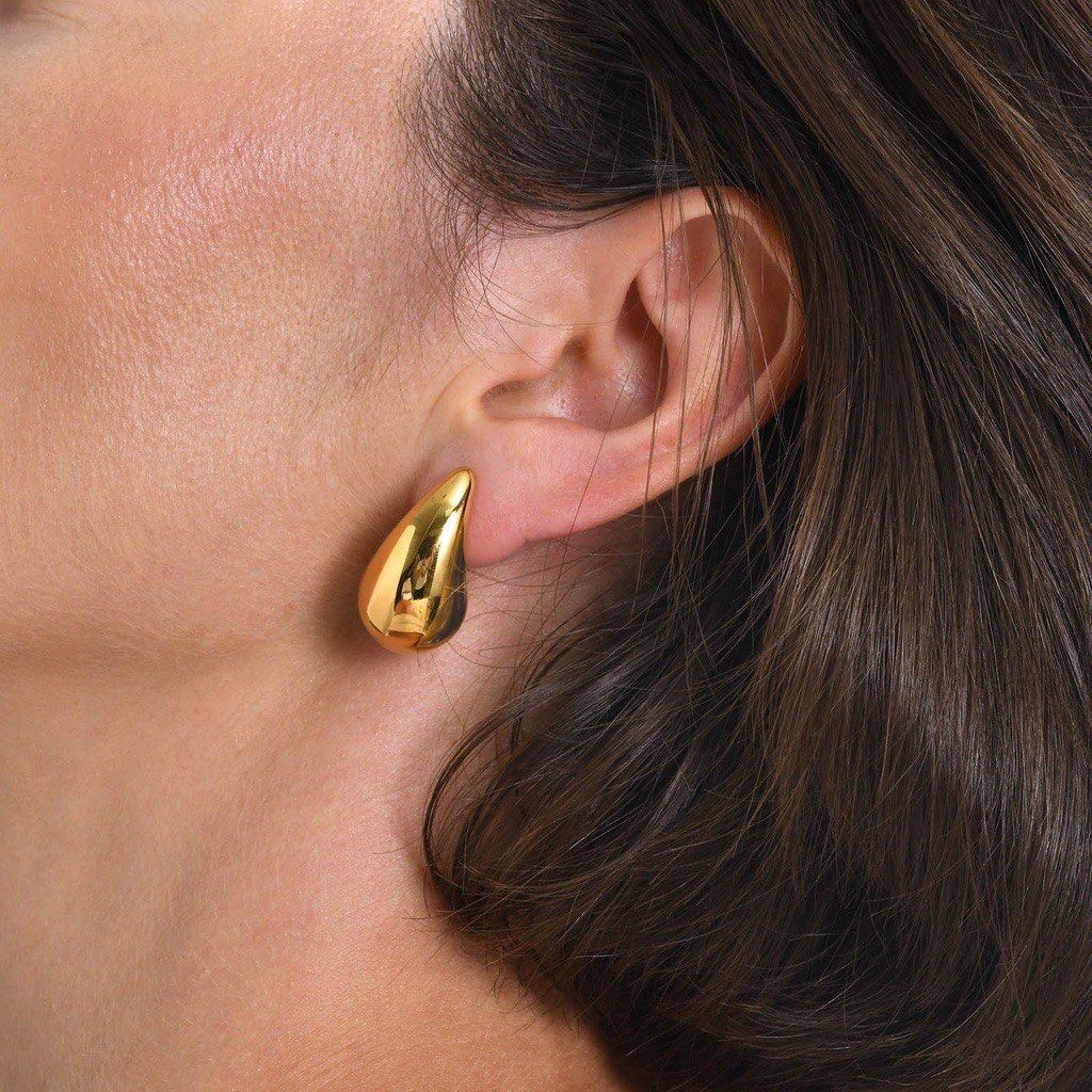 Gold chunky teardrop earrings water drop design (Category: Earrings) located in Baguio. Submitted by from.deana (Listing ID 1470166454, Image 1). Description: - Elegant gold plated teardrop earrings with a smooth, glossy finish - Water drop design that sits comfortably on the earlobe - Bold look without the heavy weight - Versatile: perfect for everyday wear or dressing up an outfit - Secure post back closure with butterfly backs included.