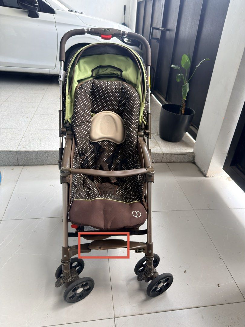Goodbaby Brown Polka Dot Baby Stroller (Category: Strollers) located in Manila. Submitted by odddeer-364e (Listing ID 1470175978, Image 3). Description: - Stylish brown polka dot design with vibrant green accents - Adjustable canopy featuring a convenient mesh peekaboo window - Spacious under-seat storage basket for diaper bags and essentials - Comfortable padded headrest insert and secure harness straps - Smooth-rotating wheels ideal for everyda