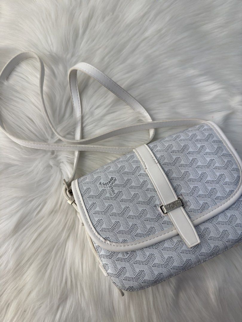 Goyard White Monogram Crossbody Bag (Category: Luxury Bags & Wallets) located in Manila. Submitted by audreyhepburn21 (Listing ID 1470317416, Image 1). Description: - Brand: Goyard Paris (Made in France) - Color/Print: White monogram with clean white leather trim - Hardware: Silver-toned with front flap buckle closure - Strap: Adjustable white leather shoulder strap - Interior: Bright yellow fabric lining with multiple compartments and pockets - 