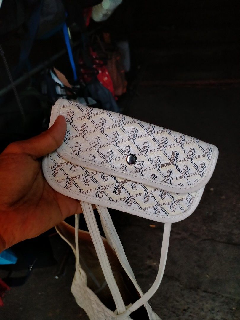 Goyard White Tote Bag with Pouch (Category: Luxury Bags & Wallets) located in Davao. Submitted by ervinpolino09 (Listing ID 1470182340, Image 3). Description: - Color & Pattern: Iconic white Goyard chevron print - Includes: Matching detachable pouch with snap button and embossed 'Goyard Paris Made in France' stamp - Design: Double shoulder straps, lightweight build, and spacious interior - Condition Note: Visible cracking along the strap edges fr