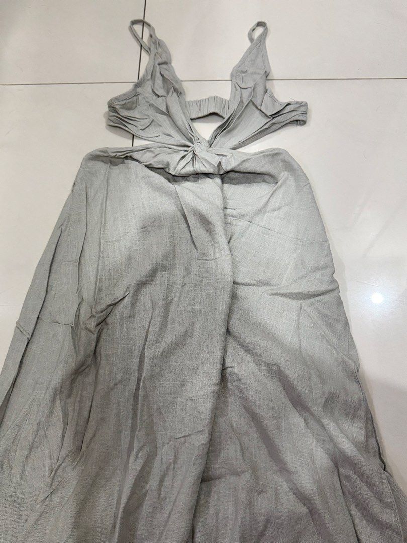 Gray Cutout Maxi Dress (Category: Dresses) located in Manila. Submitted by buymiclothes.47 (Listing ID 1470335590, Image 2). Description: Gray Cutout Maxi Dress Light gray cutout maxi dress from SHEIN Ocili 🤍 * Deep V-neckline with spaghetti straps * Twist-front detail with waist cutouts * Backless design * Flowy maxi-length skirt * Linen-look fabric * Original sale price: ₱550 Condition: Never worn, only washed. No tags. RFS: Decluttering ♡ Ple