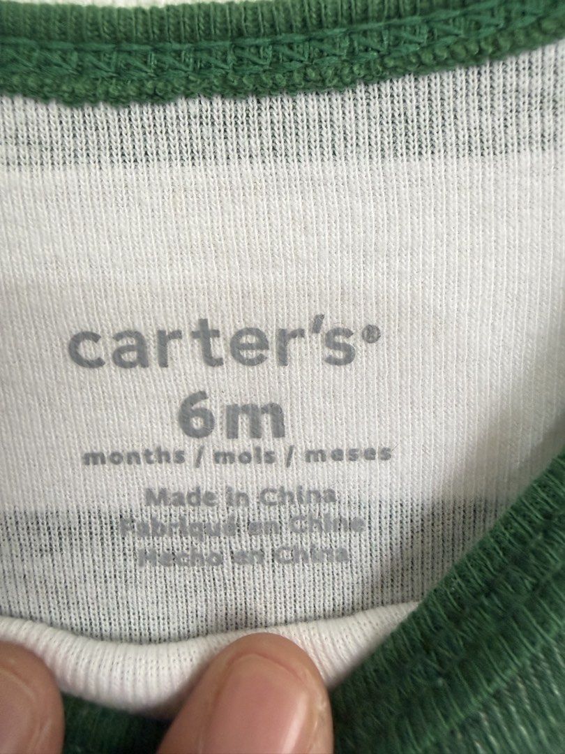 Green bodysuit (Category: Babies & Kids Fashion) located in Dasmarinas. Submitted by elizmaebau68309 (Listing ID 1470155713, Image 2). Description: Carter’s green and white horizontal-striped long-sleeve baby bodysuit (onesie)snap closures 6 -12 months Excellent condition .