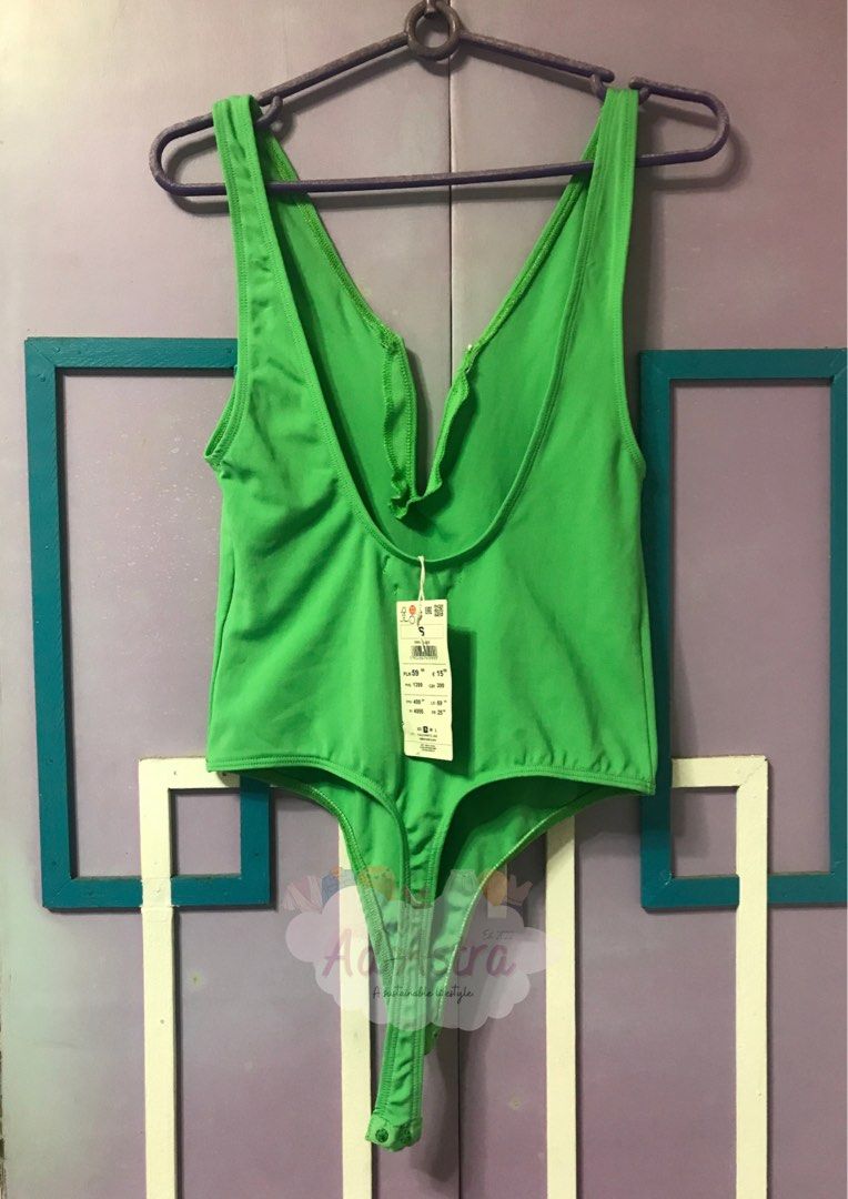 Green Bodysuit - Brand New and Authentic (Category: Sleeveless) located in Pasay City. Submitted by adastra_ph (Listing ID 1470236091, Image 2). Description: - Brand: Reserved - Condition: Brand new with original tags - Size: S - Description: V-neck type of top. Not padded. Body hugging type po yung damit. - Note: brand new with tag pero kita yung part ng bakal. See picture for reference - Regular Price: PHP 200 - MOP: GCash, Maribank, GoTyme, BD