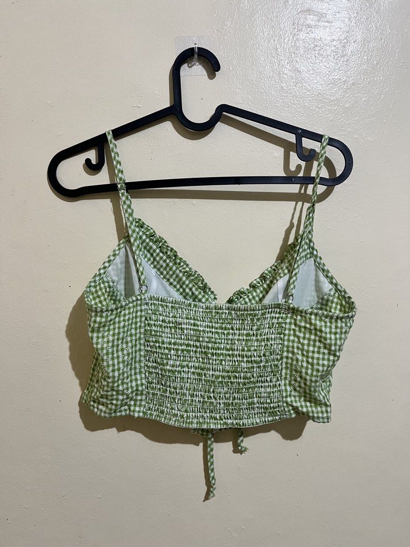 Green Gingham Floral Crop Top with Tie Front (Category: Sleeveless) located in Manila. Submitted by lovedbynixe (Listing ID 1470271164, Image 3). Description: Green and white gingham crop top ₱180 Small-med Loc pampanga - Stretchy smocked back panel for a comfortable fit - Adjustable spaghetti straps - Cute tie detail at the front - Perfect cottagecore vibe for sunny days out.