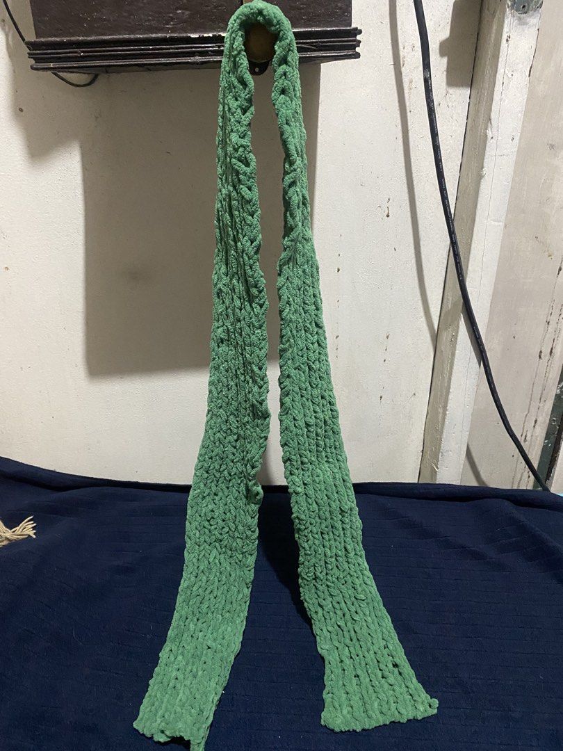 Green Hand Knitted Crochet Scarf (Category: Scarves) located in Manila. Submitted by resi.diaz (Listing ID 1470321682, Image 1). Description: - Approx: 61 x3 inches - Color: Green - Material: Soft chunky yarn - Style: Long, hand-knitted, textured crochet pattern - Perfect cozy accessory for cold weather.