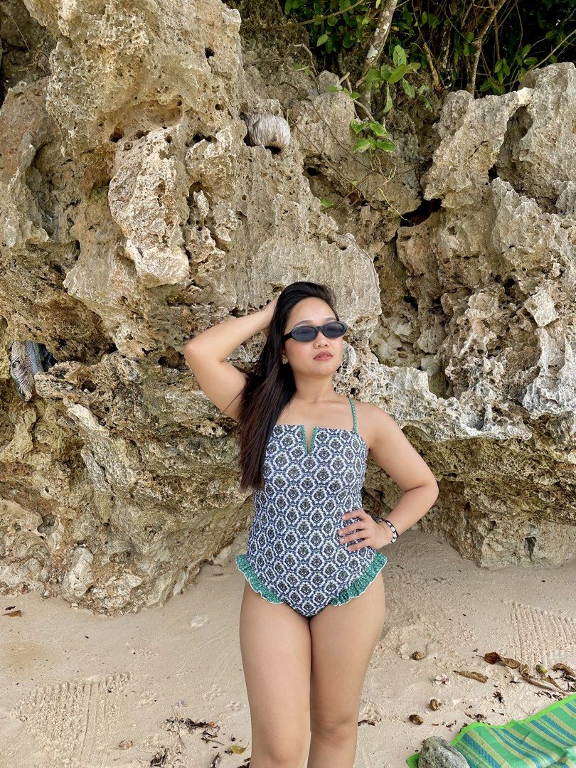 Green patterned one piece swimsuit with ruffles (Category: Bikinis & Swimsuits) located in Makati City. Submitted by gracebalms (Listing ID 1470242496, Image 3). Description: - Color/Pattern: Green and white patterned - Style: One-piece swimsuit with a slim fit and flattering silhouette - Neckline: V-notch neckline - Straps: Adjustable straps for a custom fit - Details: Cute ruffled trim along the leg openings - Condition: Clean and ready to wear