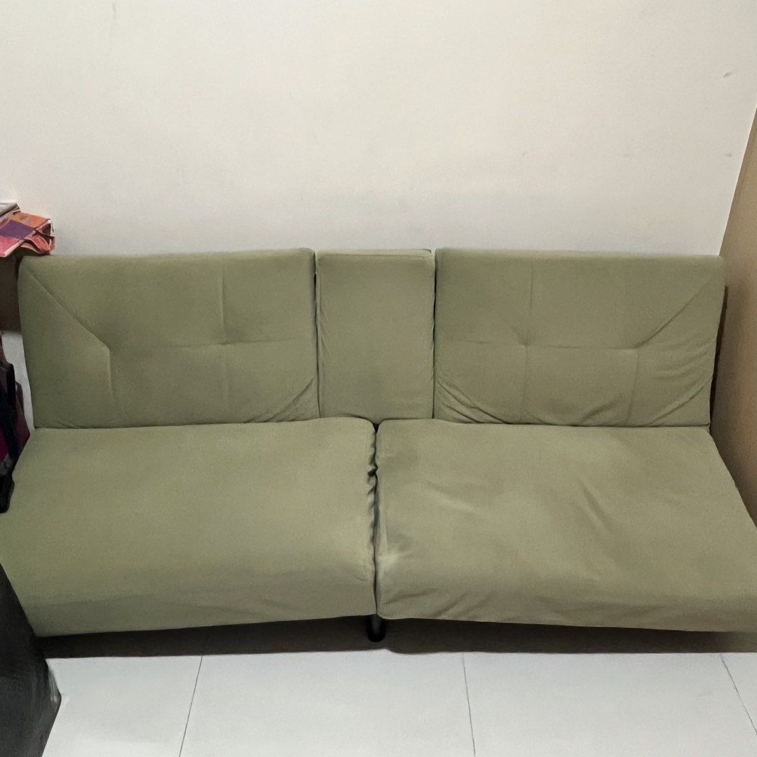 Green Sofa bed (Category: Sofas) located in Quezon City. Submitted by ilovesooshi (Listing ID 1470142256, Image 1). Description: Functions as a comfortable sofa with 2 built-in cup holders and a convenient bed Issue: Two broken legs (front), buyer can get it repaired at their own expense RFS: Too big for our space Delivery fee shouldered by the buyer. Place has an elevator for easy pick-up. Message for more photos and details .