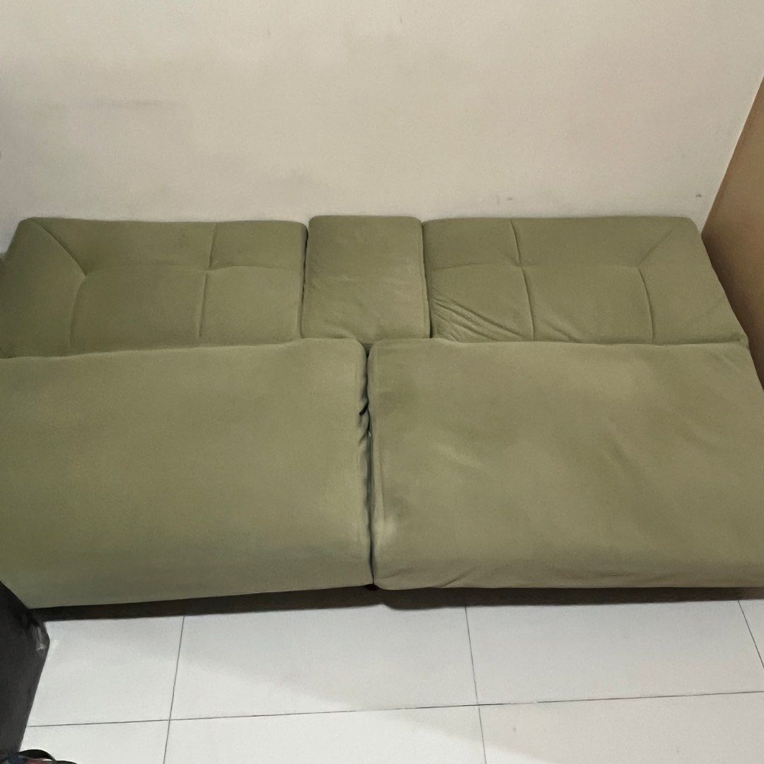 Green Sofa bed (Category: Sofas) located in Quezon City. Submitted by ilovesooshi (Listing ID 1470142256, Image 3). Description: Functions as a comfortable sofa with 2 built-in cup holders and a convenient bed Issue: Two broken legs (front), buyer can get it repaired at their own expense RFS: Too big for our space Delivery fee shouldered by the buyer. Place has an elevator for easy pick-up. Message for more photos and details .