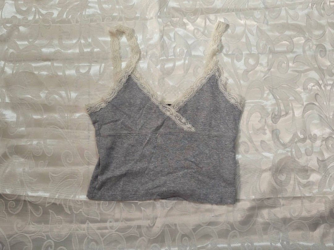 Grey Lace Trim Wrap-Style Cami (Category: Sleeveless) located in Dagupan City. Submitted by drieinpink31 (Listing ID 1470300547, Image 1). Description: 🎀 DRIÉ IN PINK ITEM DETAILS • Issue/Flaw: None 📦 SHIPPING • J&T Express • Shipping fee: Shouldered by buyer 💳 PAYMENT • GCash • Maya • COD: Not available 📌 PLEASE NOTE Any issues/flaws will be stated and shown in the listing. Please check the photos and details carefully before purchasing. 💗 