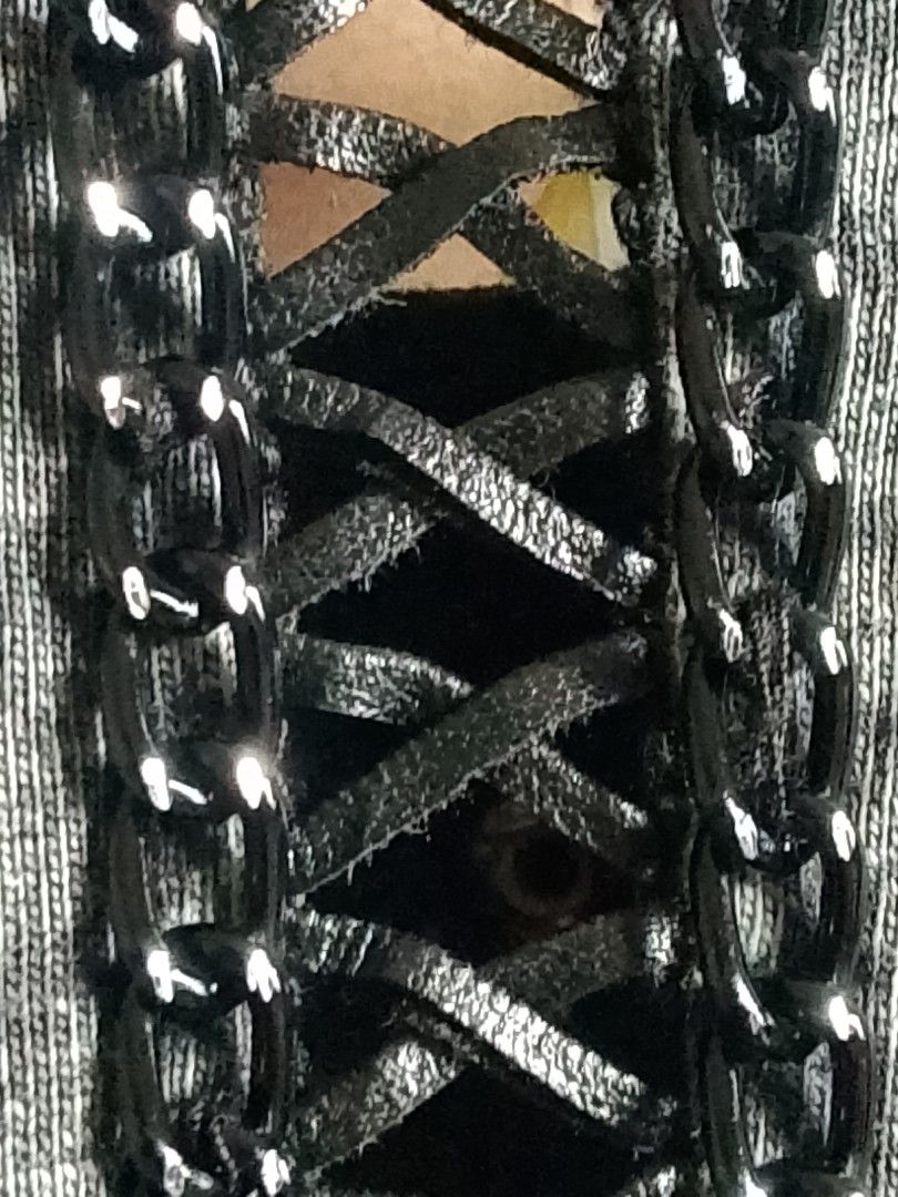 Grey Leopard Print Tank Top With Cutout Back (Category: Sleeveless) located in San Pedro. Submitted by jokwanrocks09 (Listing ID 1470146654, Image 3). Description: Acid wash grey tank top with large black and white cheetah graphic on the front. Racerback style features heavy slit and cutout details down the back, bordered by black chains and faux leather lace-up straps. Round neckline trimmed with shiny black studs. Sleeveless design, edgy street