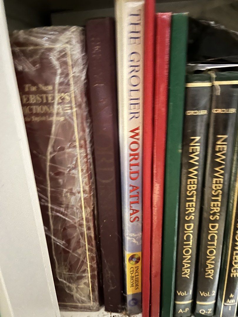 Grolier Encyclopedia of Knowledge and Webster's Dictionary Set (Category: Textbooks) located in Manila. Submitted by curated.clutter12 (Listing ID 1470151318, Image 2). Description: - Complete 20 reference book set including Grolier Encyclopedia of Knowledge, New Webster's Dictionary, and Grolier World Atlas - Elegant green and dark covers featuring classic gold lettering on the spines - Perfect for academic research, studying, or as a sophistica