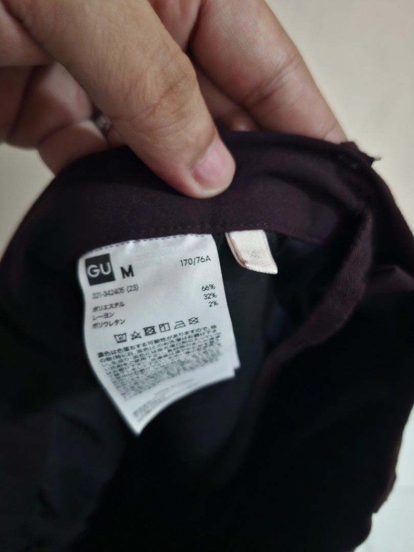 GU Dark Purple Trousers Size M (Category: Trousers) located in Quezon City. Submitted by phillip31 (Listing ID 1470348252, Image 3). Description: - Brand: GU - Color: Dark Purple - Size: M (Tag: 170/76A) - Material: 66% polyester, 32% rayon, 2% polyurethane - Closure: Standard waist button - Condition: Clean stitching and comfortable fabric blend - Style: Versatile staple for casual or office wear.
