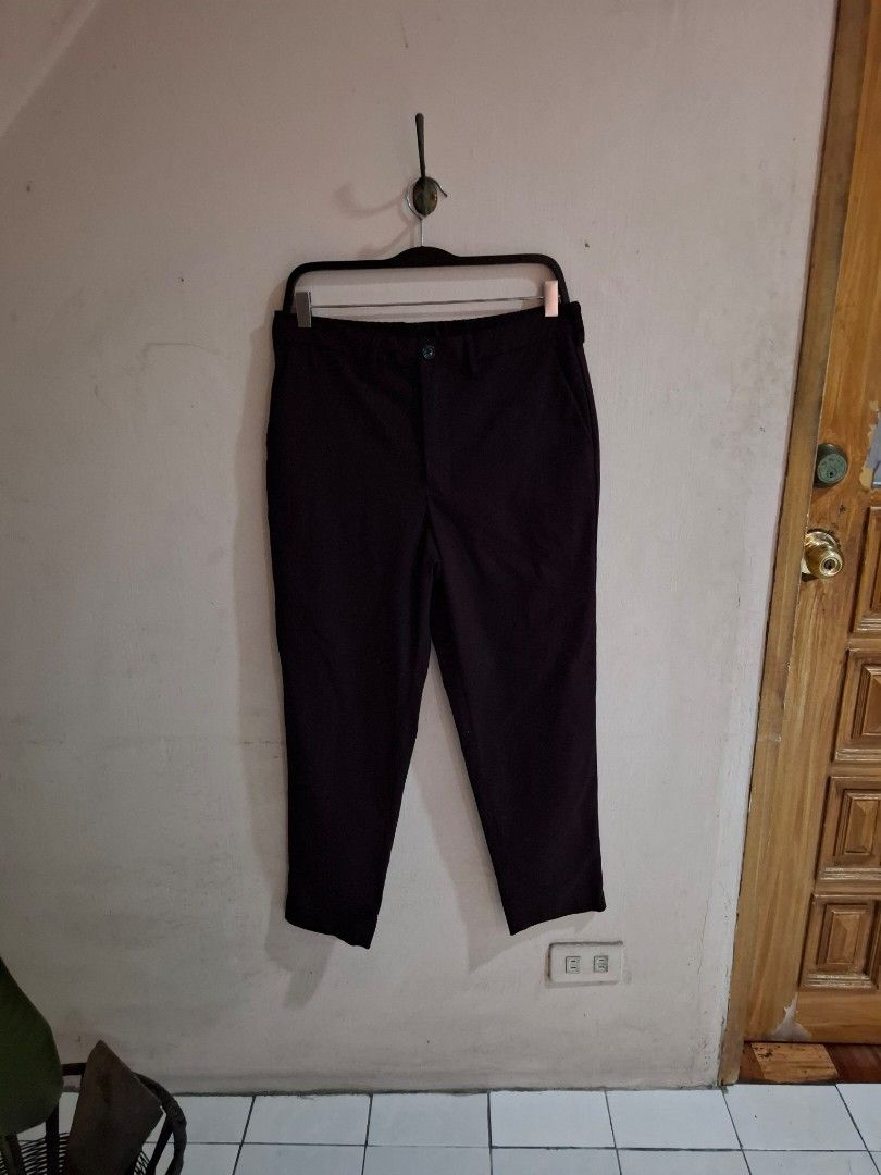 GU Dark Purple Trousers Size M (Category: Trousers) located in Quezon City. Submitted by phillip31 (Listing ID 1470348252, Image 1). Description: - Brand: GU - Color: Dark Purple - Size: M (Tag: 170/76A) - Material: 66% polyester, 32% rayon, 2% polyurethane - Closure: Standard waist button - Condition: Clean stitching and comfortable fabric blend - Style: Versatile staple for casual or office wear.