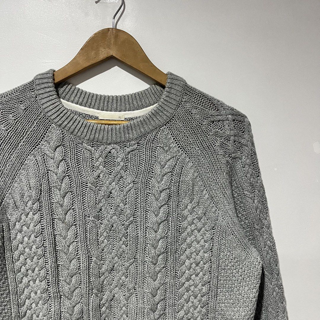 GU Grey Cable Knit Crew Neck Sweater XL (Category: Longsleeves) located in Cebu City. Submitted by clarkcamu68040 (Listing ID 1470257541, Image 2). Description: - Brand: GU - Size: XL - Material: 100% cotton - Color: Grey - Style: Classic crew neck with thick textured cable knit weave - Features: Heavy ribbed collar, cuffs, and hem - Condition/Vibe: Clean look, perfect and easy for layering in cooler weather.