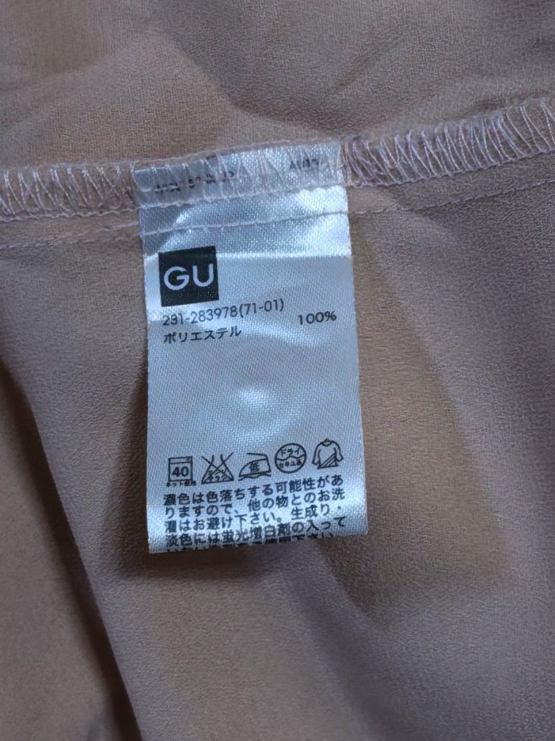 GU Pink Long Sleeve Button-Up Blouse (Category: Longsleeves) located in Baguio. Submitted by cleverhorse_3041f6 (Listing ID 1470342862, Image 3). Description: - Brand: GU - Size: M - Color: Pink - Material: 100% soft texture polyester - Features: Classic collar, front button closure, cuffed sleeves, pleated upper back, curved hem with side slits - Condition: Excellent - Perfect for office wear or casual outings.