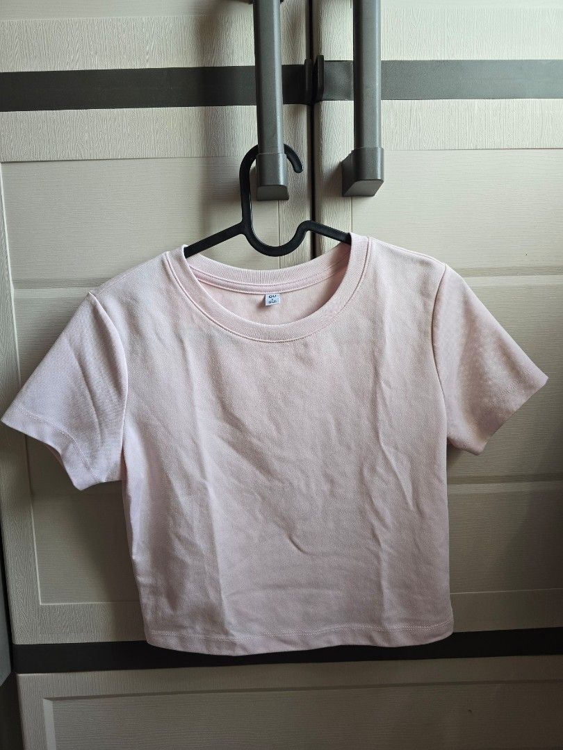 GU Pink Short Sleeve Crop Top (Category: Shirts) located in Paranaque City. Submitted by ministrwbrry (Listing ID 1470203509, Image 1). Description: - worn once to try - rfs: too small for me - Brand: GU - Color: Light pink - Style: Short sleeve crew neck t-shirt with a basic straight hem - Fit: Standard fit for everyday casual wear - Condition: Brand new with tag attached near the collar - Versatile: Easy to match with jeans, shorts, or skirts.