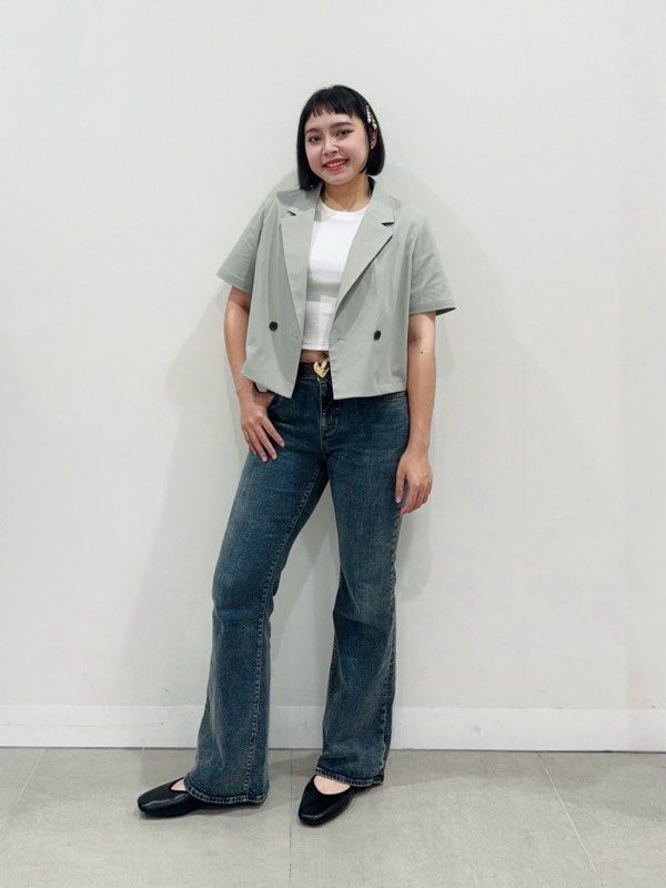 GU Short Sleeve Cropped Blazer (Category: Coats, Jackets and Outerwear) located in Solano. Submitted by hayami. (Listing ID 1470194130, Image 3). Description: - Brand: GU - Item: Short sleeve cropped blazer - Color: Sage green - Size: L (Made in Vietnam) - Material: 100% polyester (75% recycled polyester fiber) - Design: Double-breasted with dark buttons and lapel collar - Style Tip: Great for layering over casual tanks or tees for a smart-casual