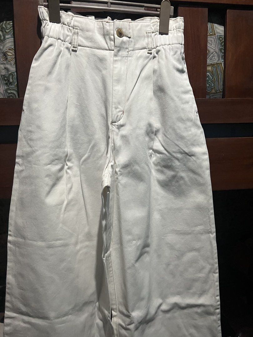 GU White High-Waist Cotton Pants (Category: Jeans) located in Caloocan City. Submitted by glamorouslysexy (Listing ID 1470169375, Image 1). Description: - Brand: GU without tag - Color: Clean White - Material: 100% Cotton (lightweight and comfortable) - Style: High-waist with front pleats and belt loops light brown contrast stitching - Waistband: Elastic at the back for a comfortable fit - Closure: Button closure with zip fly - Product Code: 221-