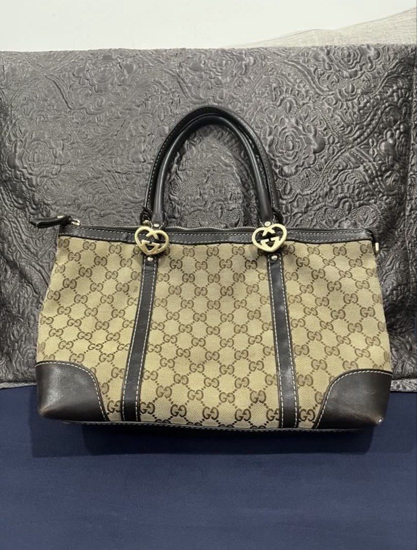 Gucci Canvas Lovely Tote Bag (Category: Luxury Bags & Wallets) located in Cotabato. Submitted by nacreous (Listing ID 1470290639, Image 2). Description: DESCRIPTION: ➤ Pre-loved item ➤ Visible flaws include rubs on two corners only and minimal fading on the gold hardware (additional photos will be provided) FEATURES: Exterior ➤ Beige canvas material with brown genuine leather trims ➤ Brown “GG” monogram ➤ Gold hardware Interior ➤ Cream-colored ca