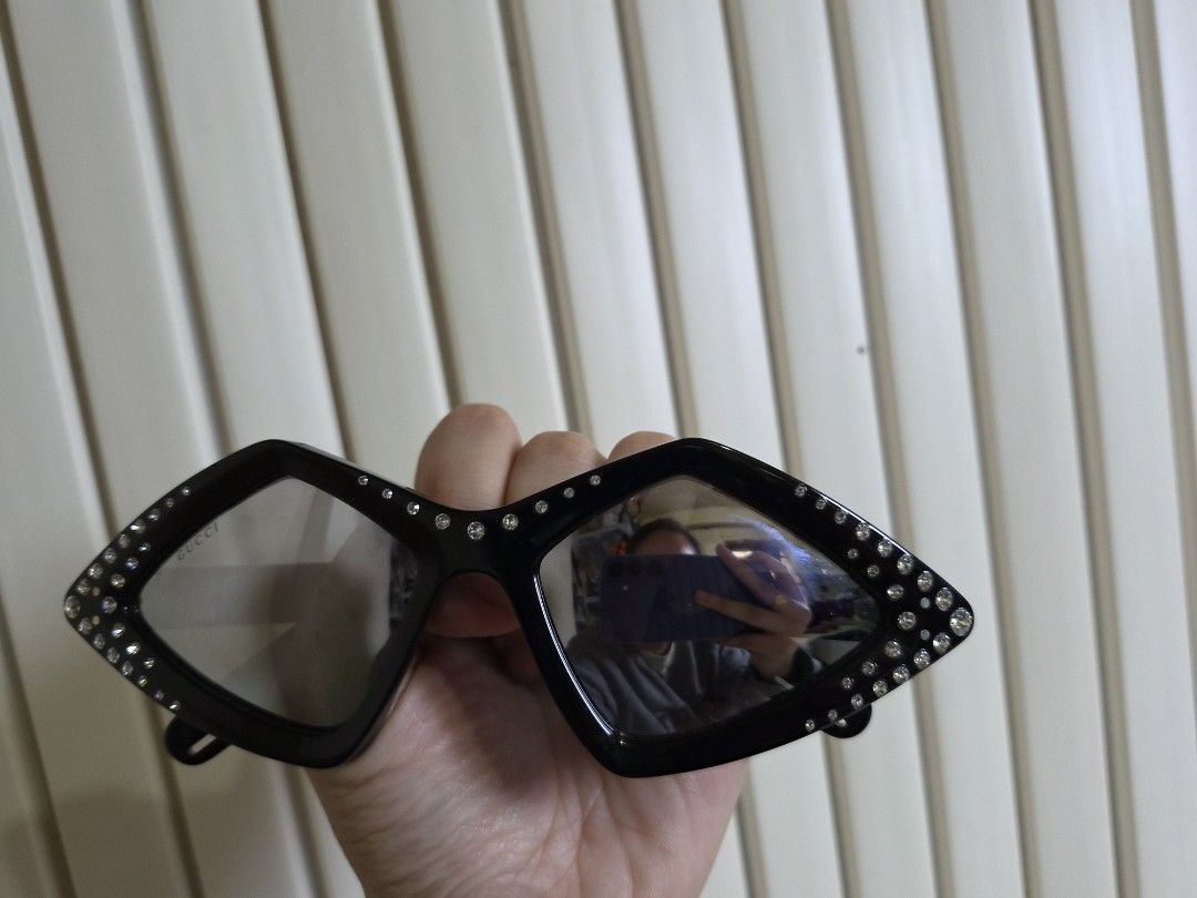 Gucci Diamond Rhinestone Sunglasses Black (Category: Sunglasses & Eyewear) located in Manila. Submitted by boldbear2001 (Listing ID 1470239528, Image 1). Description: - Brand: Gucci - Style: Diamond-shaped statement sunglasses - Color: Black with clear frames - Details: Sparkly rhinestones along the edges, branded lettering on lens and temple arms - Origin: Made in Italy - Condition: Excellent.