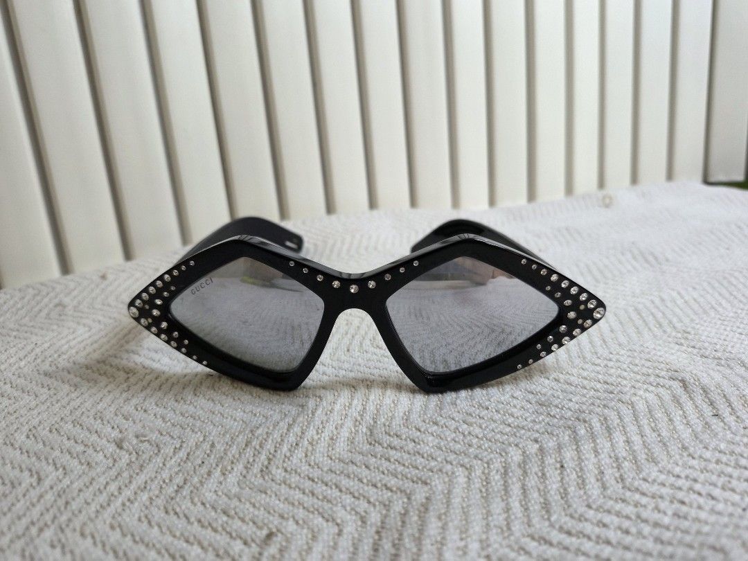 Gucci Diamond Rhinestone Sunglasses Black (Category: Sunglasses & Eyewear) located in Manila. Submitted by boldbear2001 (Listing ID 1470239528, Image 2). Description: - Brand: Gucci - Style: Diamond-shaped statement sunglasses - Color: Black with clear frames - Details: Sparkly rhinestones along the edges, branded lettering on lens and temple arms - Origin: Made in Italy - Condition: Excellent.
