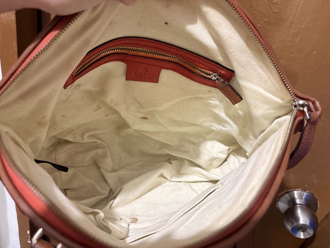 Gucci GG Canvas Bamboo Handle Tote Bag (Category: Tote Bags) located in Mandaluyong City. Submitted by gentle.segoviajam (Listing ID 1470230437, Image 3). Description: Gucci tote bag in beige GG canvas with coral pink leather trim. Bamboo details on the front strap rings. Dual brown leather shoulder handles. Zip top closure. Cream canvas interior lining includes a zippered pocket. Serial number stamped inside: 339002 1768..