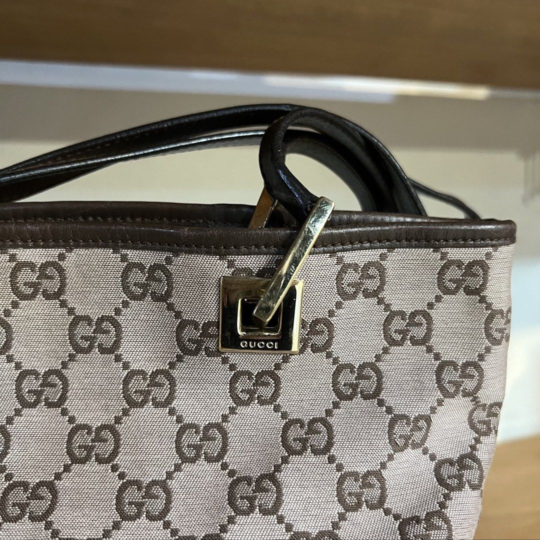 Gucci GG Canvas Tote Bag Brown (Category: Luxury Bags & Wallets) located in Binan City. Submitted by lovedbynins (Listing ID 1470230384, Image 3). Description: Authentic Gucci tote in classic brown GG monogram canvas with dark brown leather straps and gold hardware. Message me for the bag code. In good condition overall, with some signs of wear and there’s a minor stain inside the bag. Kindly check and zoom photos for details 😊 No inclusions..