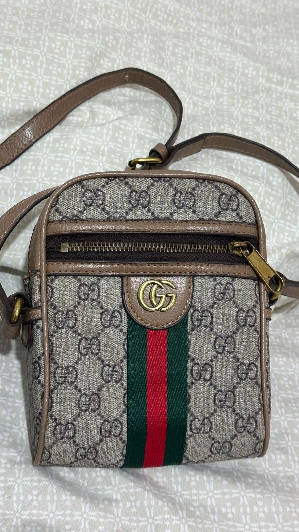 Gucci GG Monogram Mini Messenger Bag – Green & Red Stripe (Category: Luxury Bags & Wallets) located in San Juan, La Union. Submitted by ayraaxfzz (Listing ID 1470295409, Image 1). Description: Original price: Approximately ₱68,000–₱70,000 Selling my pre-loved Gucci messenger bag in excellent overall condition. The exterior is very well-maintained, with no visible damage. It features the classic GG monogram canvas, green-and-red Web stripe, gold-t