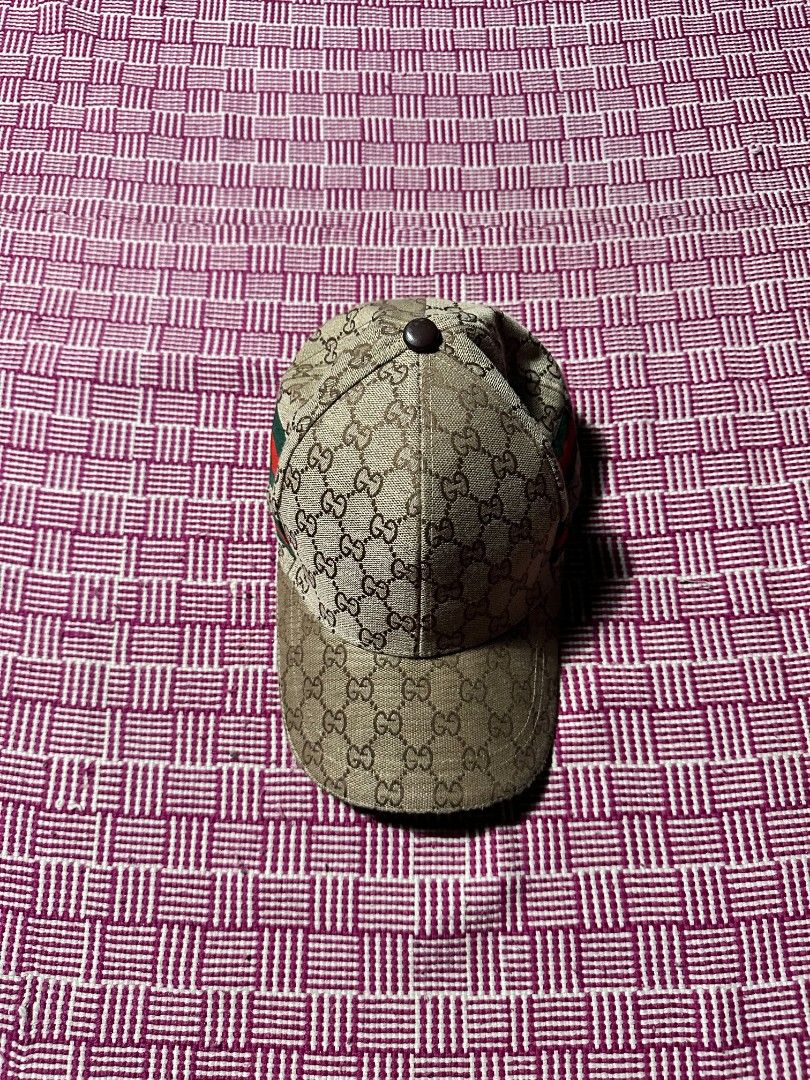 Gucci GG Supreme Baseball Cap (Category: Caps & Hats) located in Manila. Submitted by wardrobeph.com (Listing ID 1470318440, Image 1). Description: - Authentic Gucci baseball cap in classic beige GG monogram canvas - Iconic red and green web stripe detail on the sides - Adjustable back strap with durable metal hardware - Complete with interior Gucci branding tags and care labels - Great way to elevate any casual everyday outfit - Condition: Excel