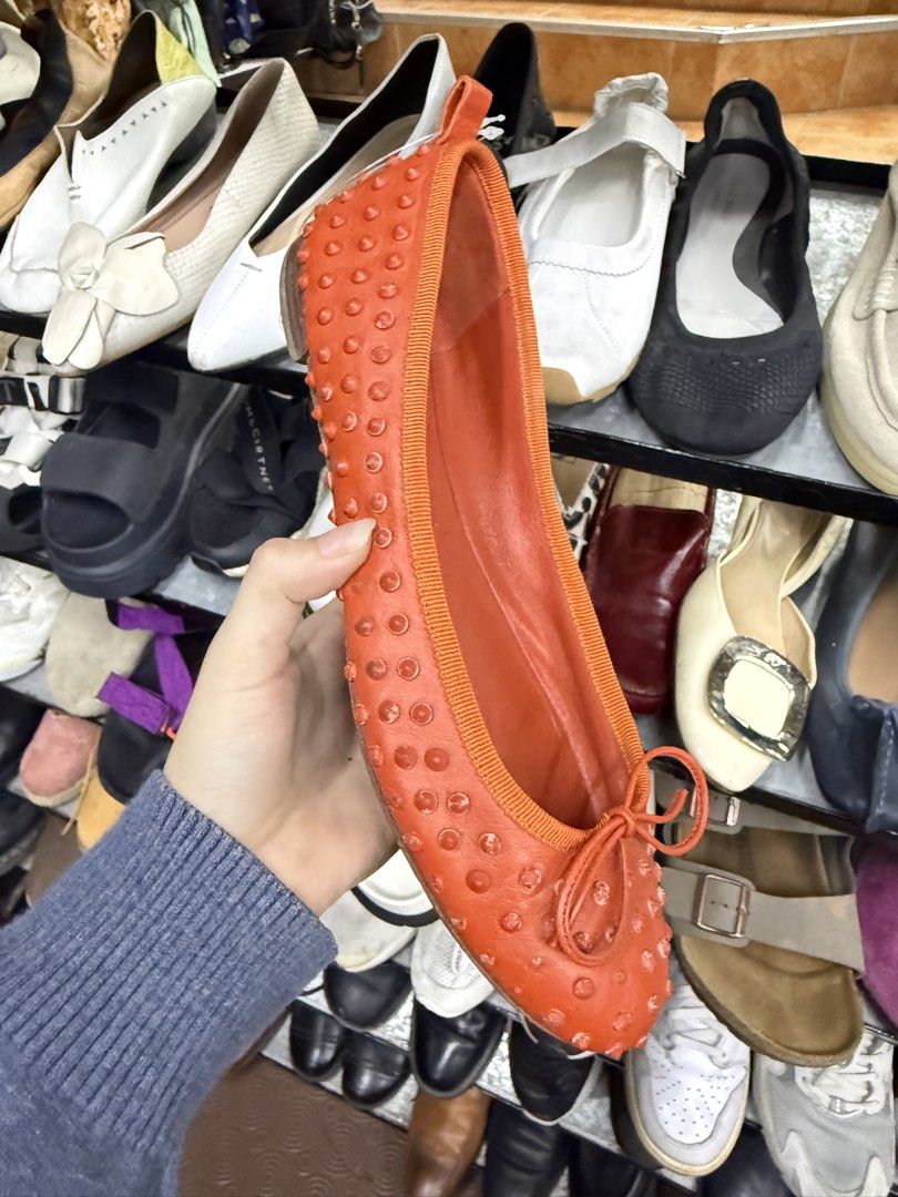Gucci Orange Studded Leather Flats Size 38 (Category: Flats & Sandals) located in Abucay. Submitted by fastlion.584bdf (Listing ID 1470269175, Image 1). Description: - Brand: Gucci - Style: Slip-on flats with front bow detail - Color: Bright orange - Size: 38 (marked on sole) - Material: Leather lining with all-over stud embellishments - Condition: Upper leather is clean and bright; normal wear on the bottom soles from walking.