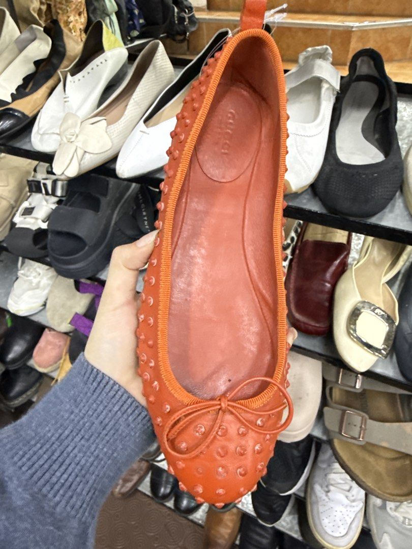 Gucci Orange Studded Leather Flats Size 38 (Category: Flats & Sandals) located in Abucay. Submitted by fastlion.584bdf (Listing ID 1470269175, Image 2). Description: - Brand: Gucci - Style: Slip-on flats with front bow detail - Color: Bright orange - Size: 38 (marked on sole) - Material: Leather lining with all-over stud embellishments - Condition: Upper leather is clean and bright; normal wear on the bottom soles from walking.