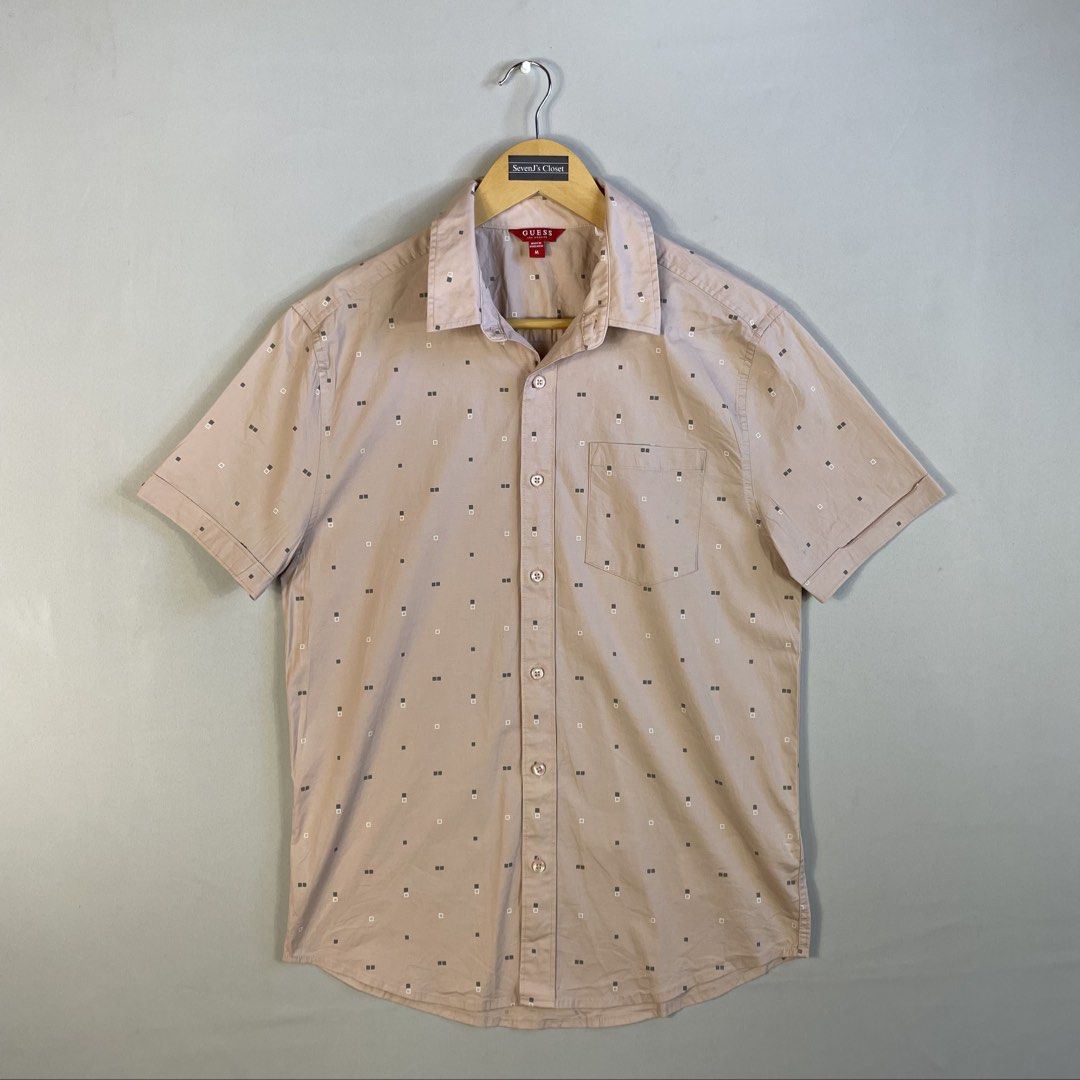 GUESS | Beige-Tan Geometric Micro-Print Button-Down Shirt (Category: Tshirts & Polo Shirts ) located in Norzagaray. Submitted by sevenjscloset (Listing ID 1470272591, Image 1). Description: - Brand: GUESS - Color: Beige-tan with geometric micro-print - Size: Medium (Length: 26.5", Width: 18.5") - Model Reference: 5’10” height , 70kg weight - Details: Short sleeves, front button closure, single chest pocket - Condition: 10/10, clean and zero visib