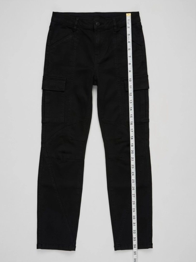 Guess by Marciano Black Cargo Pants Size 2 (Category: Jeans) located in Caba. Submitted by valerie_18947 (Listing ID 1470274100, Image 1). Description: Authentic Guess by Marciano Slim Cargo Pants (Size 2 / US 26) Coated Black attach Condition: Select: "Like New" Description: Selling a 100% Authentic pair of Guess by Marciano Slim Cargo Pants in a crisp, dark black. This is from Guess's premium high-end line—gorgeous tailoring and high-quality ma