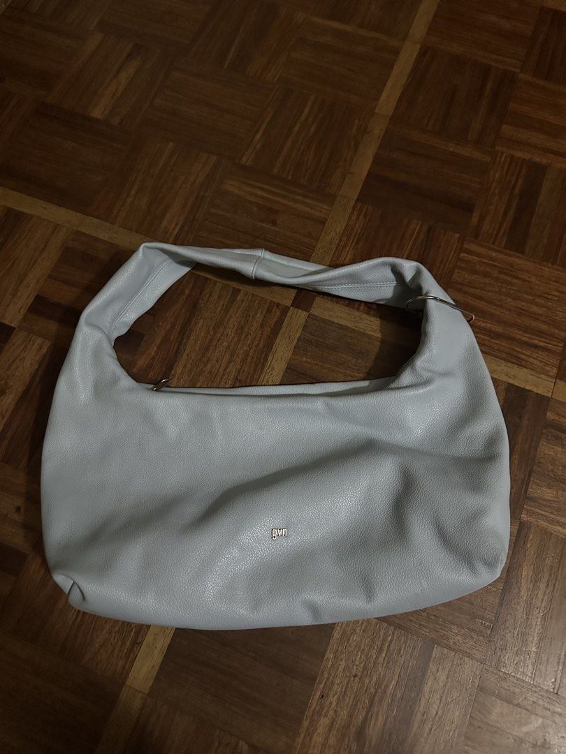 GVN Medium Light Hobo Bag (Category: Shoulder Bags) located in Davao. Submitted by fashiondeclutter11 (Listing ID 1470238623, Image 1). Description: - Brand: Gvn - Color: Light blue - Material: Pebbled faux leather with silver-tone hardware - Closure: Zippered top with stylish ring detail on the strap - Interior: Cream-colored lining with an extra zippered pocket - Design: Roomy everyday hobo shape that fits all daily essentials - in very very go