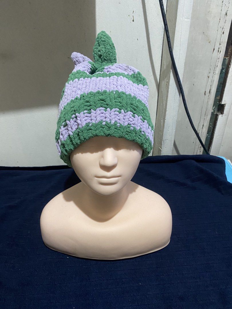 Handmade Crochet Bunny Ear Striped Beanie Hat (Category: Hats & Beanies) located in Manila. Submitted by resi.diaz (Listing ID 1470322227, Image 1). Description: - Handmade purple and green striped beanie - Thick plush yarn for ultimate warmth - Cute bunny ear details on top - Chunky knit texture - Stretch fit, fits most head sizes.