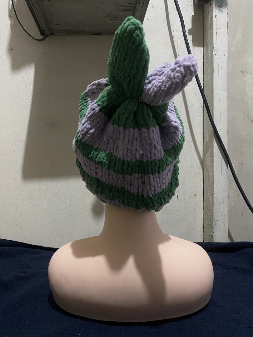 Handmade Crochet Bunny Ear Striped Beanie Hat (Category: Hats & Beanies) located in Manila. Submitted by resi.diaz (Listing ID 1470322227, Image 3). Description: - Handmade purple and green striped beanie - Thick plush yarn for ultimate warmth - Cute bunny ear details on top - Chunky knit texture - Stretch fit, fits most head sizes.