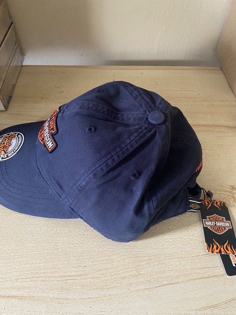 Harley Davidson Bar & Shield Motorcycle Cap with tags and sticker (Category: Caps & Hats) located in Quezon City. Submitted by carlos132 (Listing ID 1463070986, Image 2). Description: - Navy blue baseball cap - Classic Harley-Davidson logo on front - "Harley-Davidson" embroidered on back - Adjustable strap for a comfortable fit - Perfect for Harley-Davidson fans - Comes with original tags.