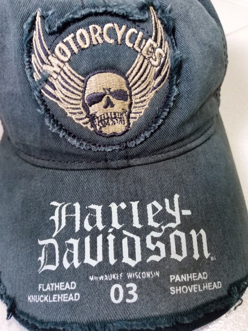 Harley Davidson Distressed Cap Skull Wings Logo Size L (Category: Caps & Hats) located in Manila. Submitted by onewikstraight (Listing ID 1470209900, Image 2). Description: - Authentic Harley-Davidson distressed cap in dark grey - Features embroidered skull & wings patch with Milwaukee Wisconsin printed graphics - Size: L (labeled inside) - Material: 100% cotton, made in Bangladesh - Design details: Distressed finish with stylish frayed edges on 