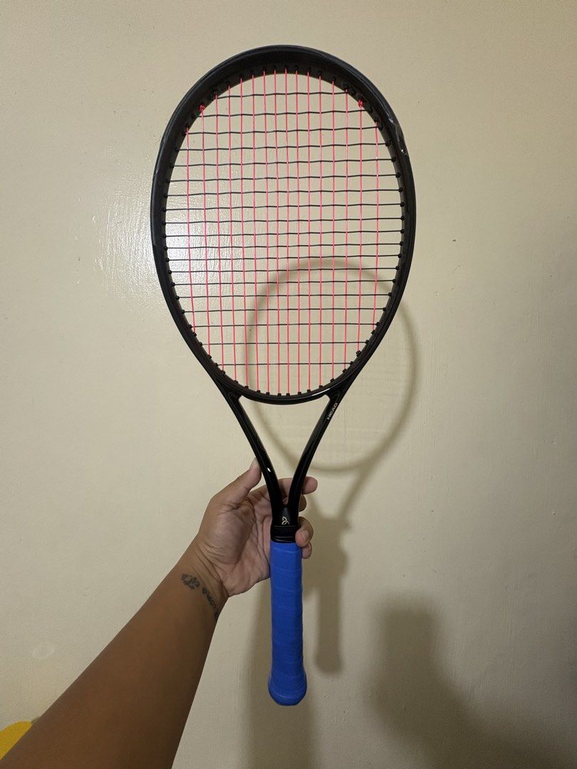 Head Speed Legend MP Tennis Racket (Category: Racket and Ball Sports) located in Manila. Submitted by therealhandsoftime (Listing ID 1470316888, Image 1). Description: - Brand/Model: Head Tennis Racket - Color: Black with vibrant pink strings - Grip Size: 4 1/4 (G2) with blue overgrip - Head Size: 100 sq in - String Pattern: 16x19 - Weight: 300g / 10.6 oz - Balance: 320 mm / 1 in HL - Condition: Ready for your next match.
