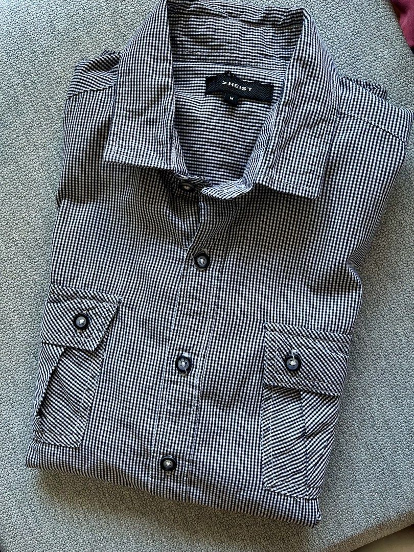 HEIST Men's Black and White Gingham Button-Down Shirt Size M (Category: Tshirts & Polo Shirts ) located in Pasig City. Submitted by TrishODeclutter (Listing ID 1470153075, Image 1). Description: - Brand/Style: HEIST button-down shirt - Pattern: Black and white gingham - Size: Medium - Features: Long sleeves with button cuffs, double chest pockets, classic collar, and front button fastening - Fabric: Lightweight and comfortable - Occasion: Perfect