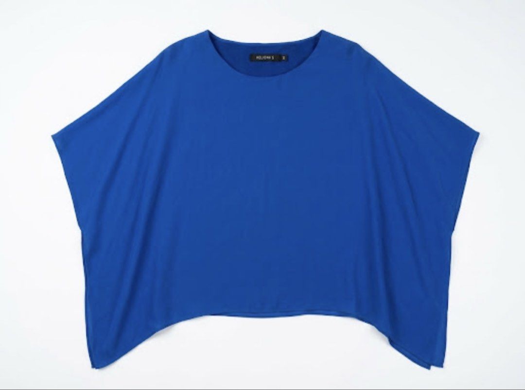 HELIENA'S Royal Blue minimalist Blous (Category: Blouses) located in Donsol. Submitted by saksthriftavenuebyluckymaria8 (Listing ID 1470290285, Image 2). Description: - Brand: HELIENA - Color: Royal Blue - Size: M - Material: Smooth silk blend fabric - Design: Relaxed boat neckline, wide flowing sleeves, and asymmetric curved hem - Style: Versatile; easy to dress up or keep casual HELIENA’s cobalt blue silk minimalist top Sz M chest 20-24in measu