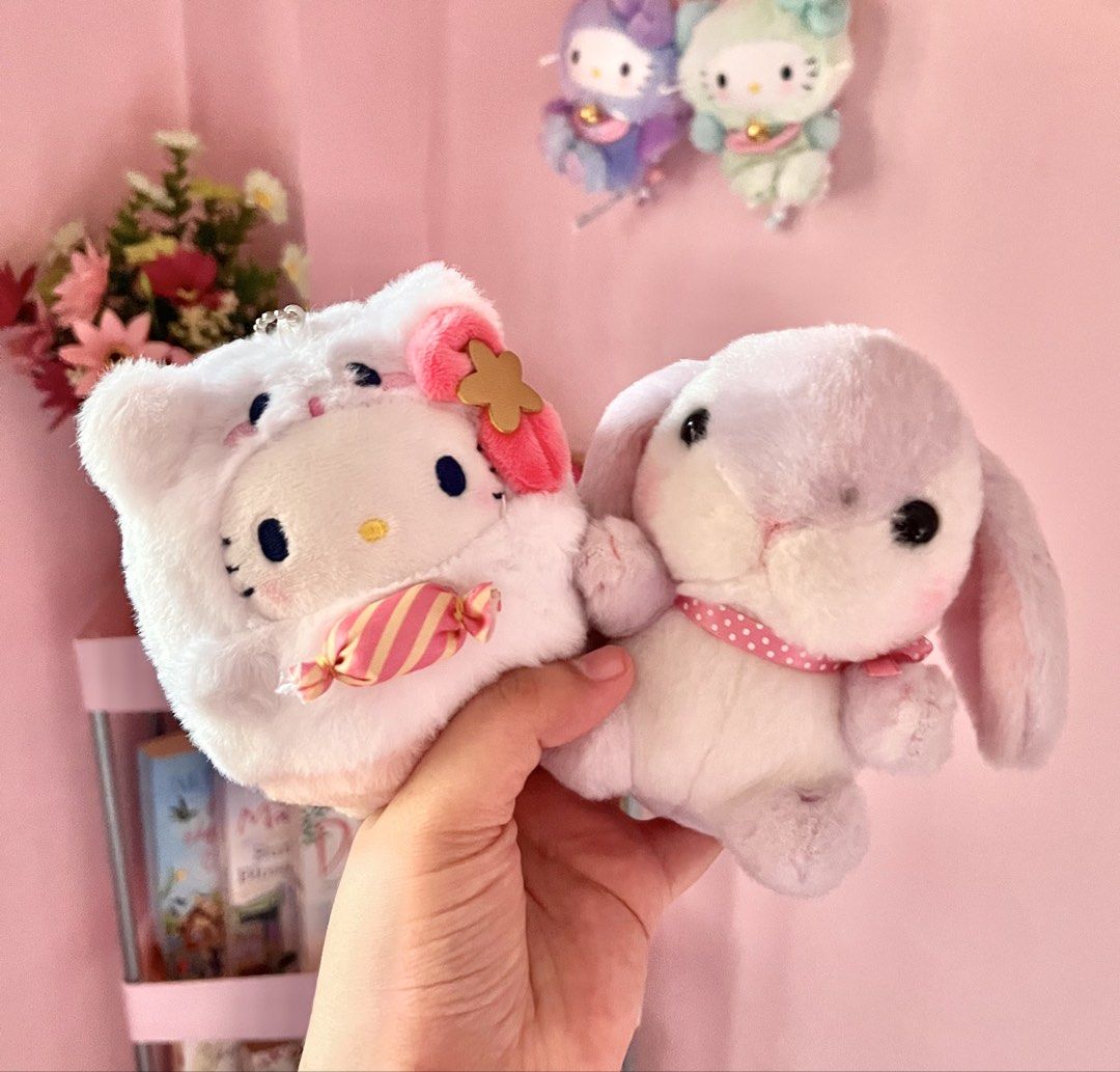 Hello Kitty and Bunny Plush Keychains Set (Category: Plushies & Soft Toys) located in Imus. Submitted by muyingyingyinggg (Listing ID 1470237651, Image 1). Description: - Authentic Nakajima plush keychains (Set of 2) - Includes Kitty in fluffy hood with candy & purple bunny with polka dot ribbon - Comes with bead chains for easy hanging on bags or keys - Brand new with original tags intact - Perfect gift or collection addition.